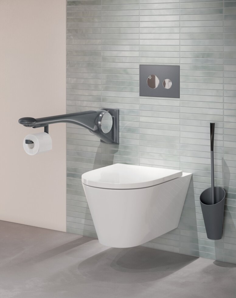 WC equipped with folding support handle and toilet brush in the colour anthracite matt